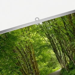 Silver top poster bar with a wall-mounting bracket.